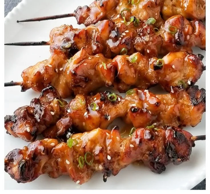 Delicious plate of homemade teriyaki chicken garnished with green onions