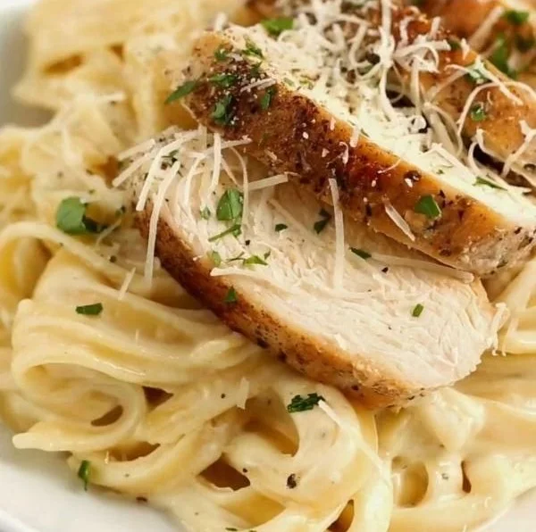 Creamy Chicken Alfredo Pasta with grilled chicken and parmesan cheese