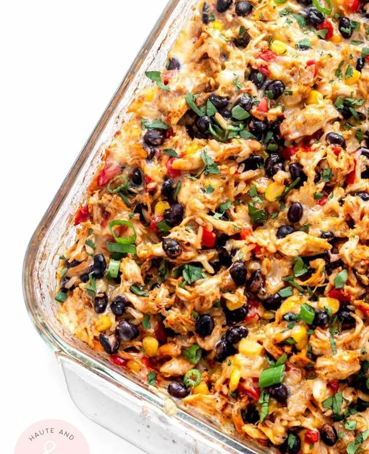 Delicious Chicken Burrito Casserole topped with cheese and fresh ingredients