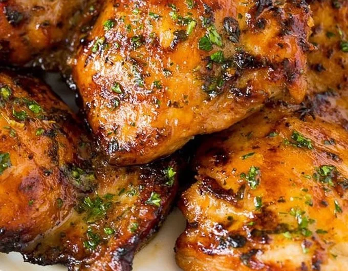 Delicious marinated chicken thighs ready for grilling or baking.