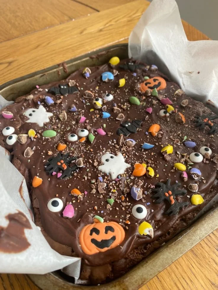 Spooky Halloween Brownie decorated with ghost and pumpkin designs