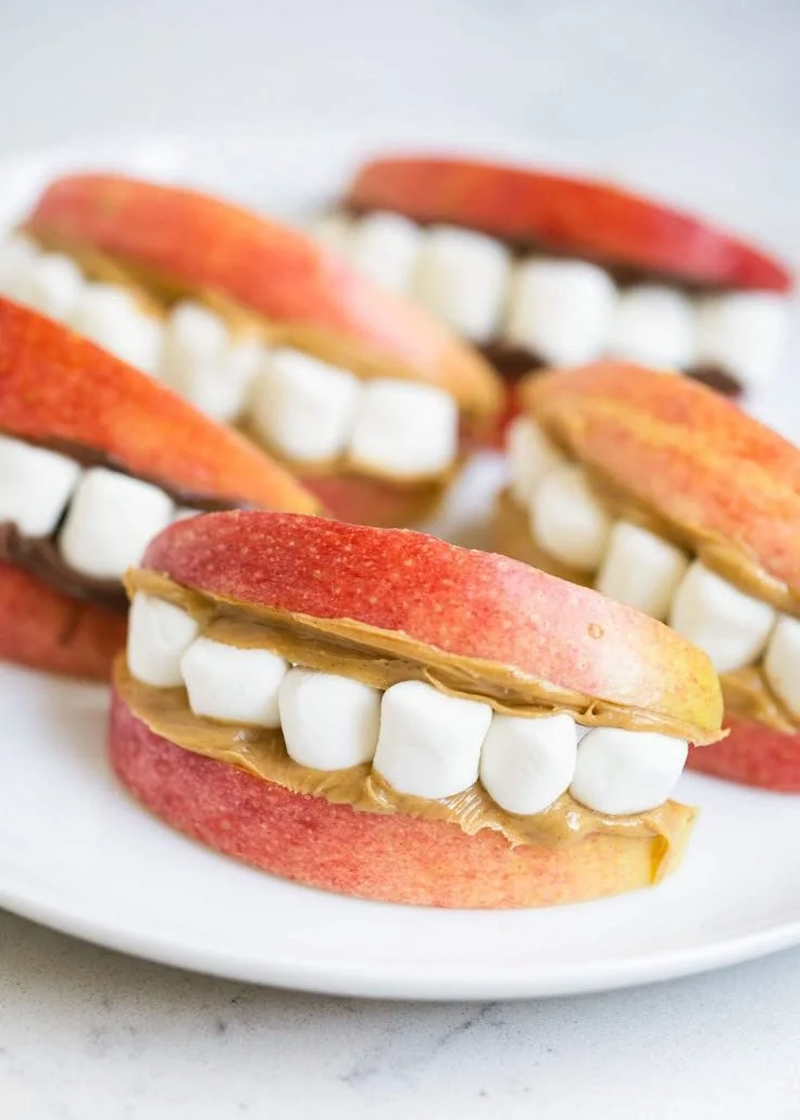 Healthy Halloween snacks featuring fruits and veggies for a festive treat.