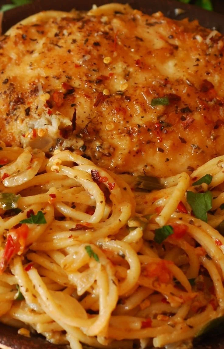 Delicious crispy Parmesan Chicken ready to be served with a side of vegetables