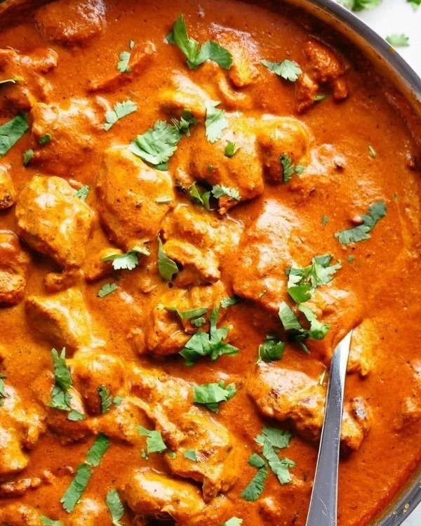 Delicious plate of restaurant-quality chicken tikka masala served with basmati rice