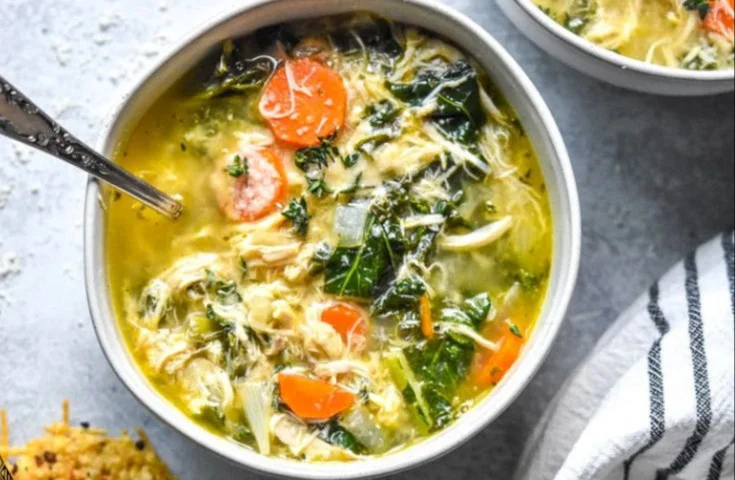 Delicious low carb rotisserie chicken soup in a bowl garnished with parsley