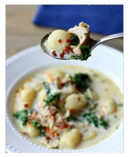 Bowl of slow cooker chicken gnocchi soup with kale and parmesan