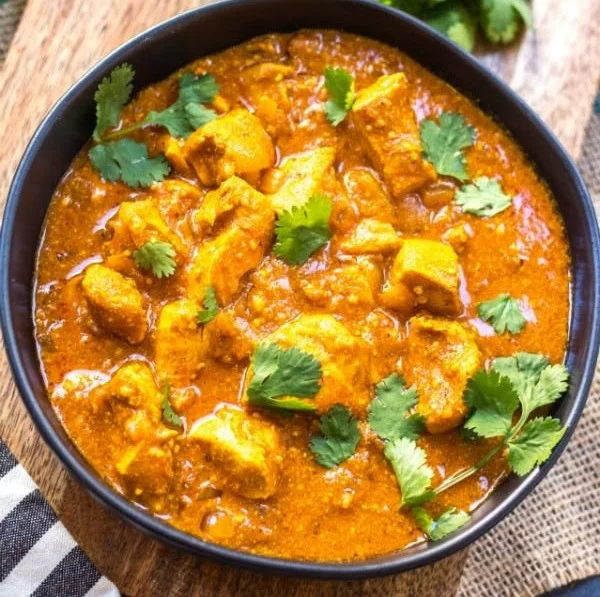 Bowl of Slow Cooker Chicken Tikka Masala, Whole30, Paleo, Keto-friendly meal