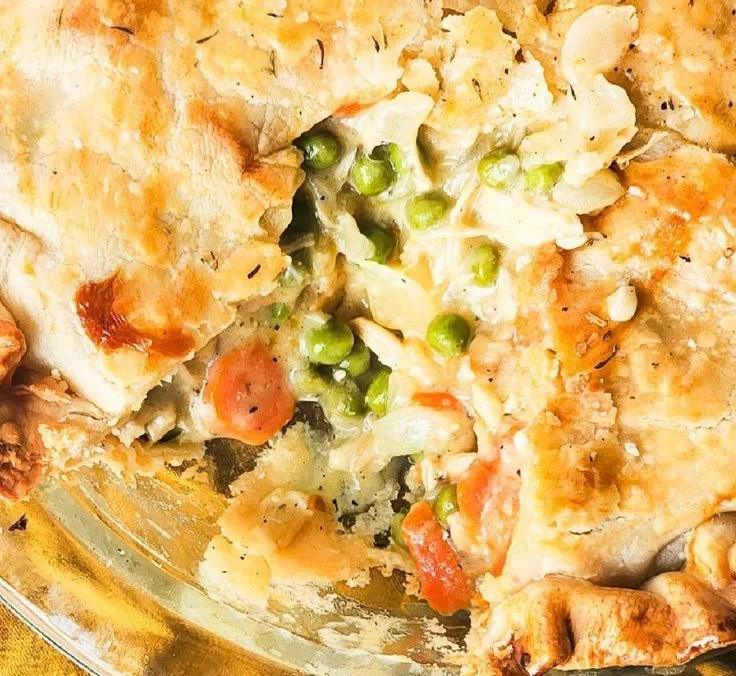 Delicious homemade chicken pot pie with cream of chicken soup on a table.