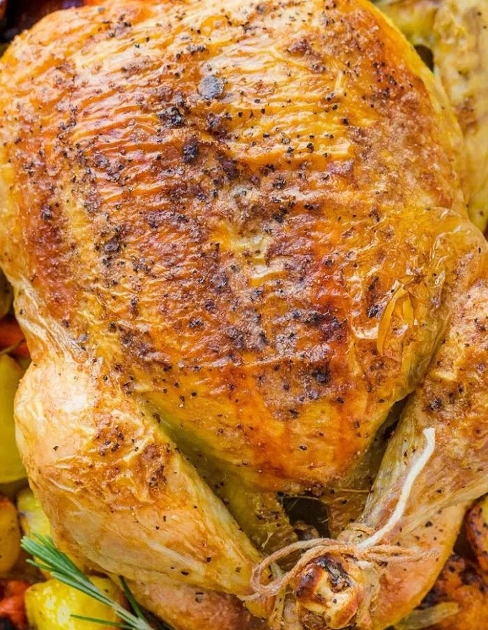 Deliciously tender and juicy roasted chicken served on a rustic platter