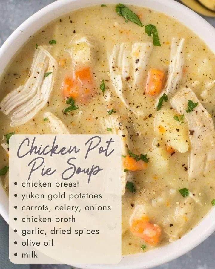 Bowl of chicken pot pie soup with vegetables and herbs