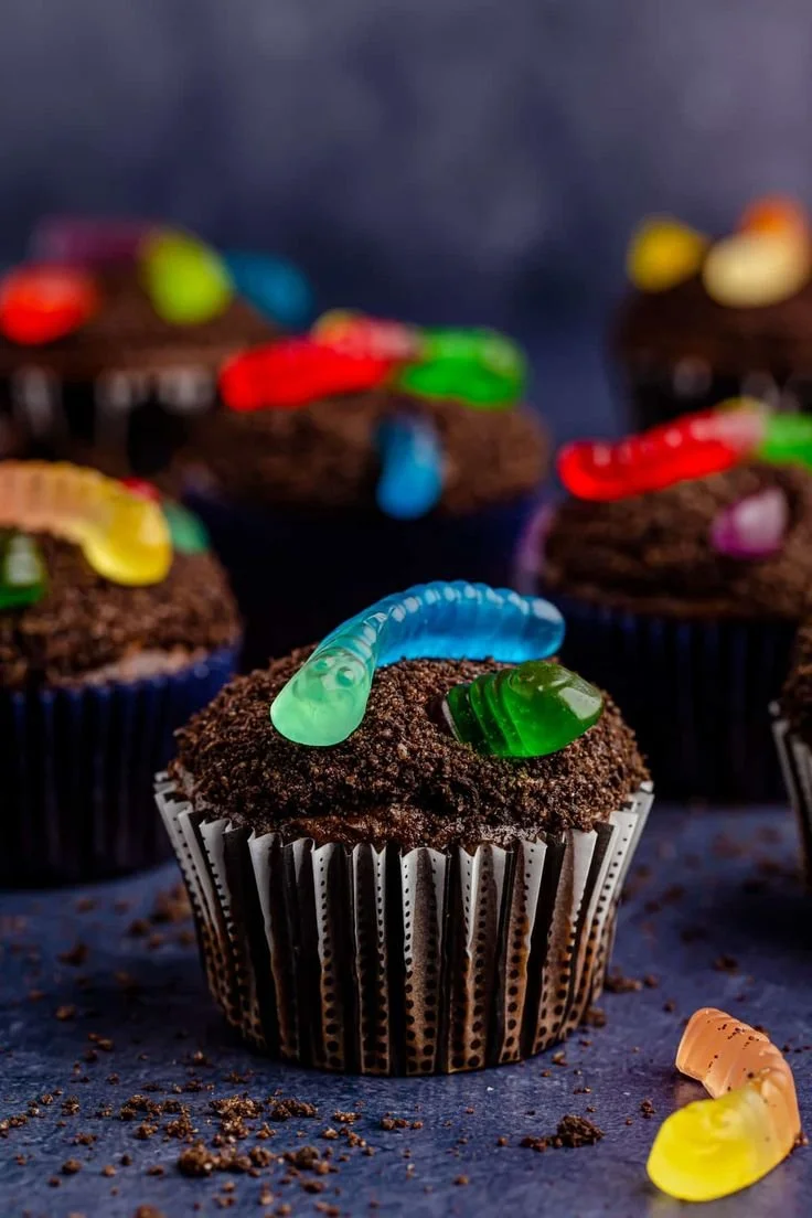 Delicious dirt cupcakes topped with gummy worms for a fun dessert