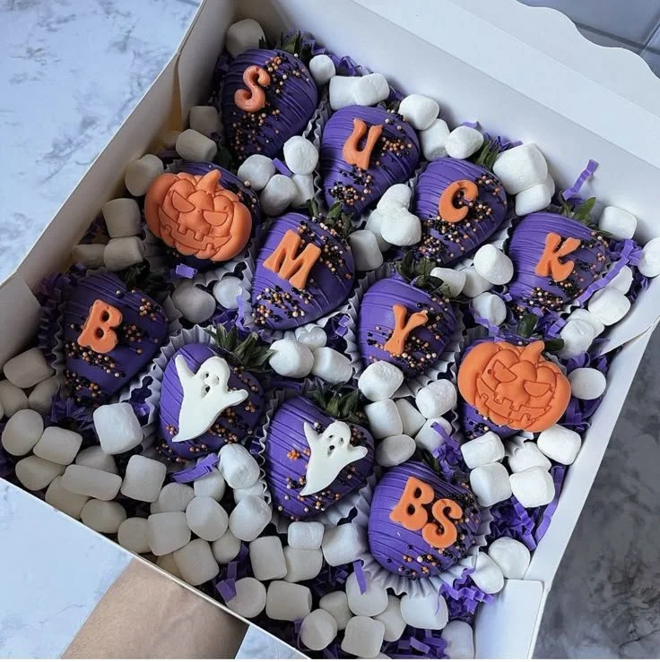 Halloween-themed chocolate covered strawberries for festive celebrations