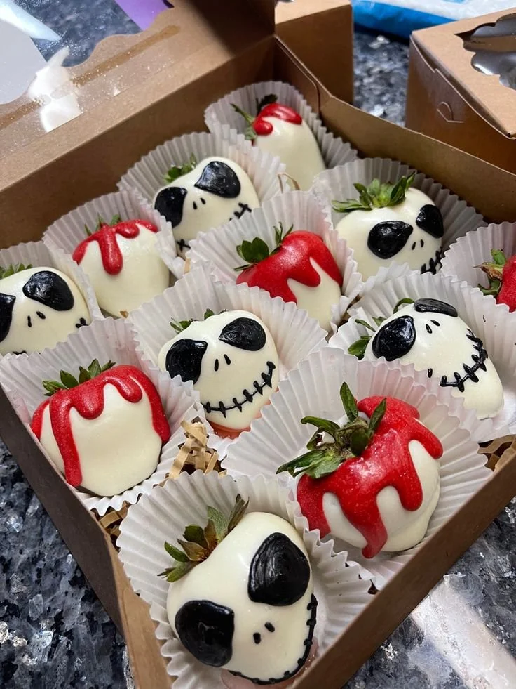 Delicious Jack Skellington decorated strawberries for a Halloween-themed dessert.