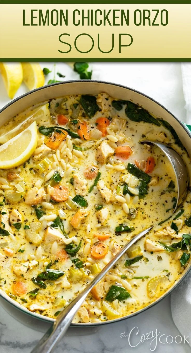 Bowl of Lemon Chicken Orzo Soup garnished with fresh herbs and lemon slices