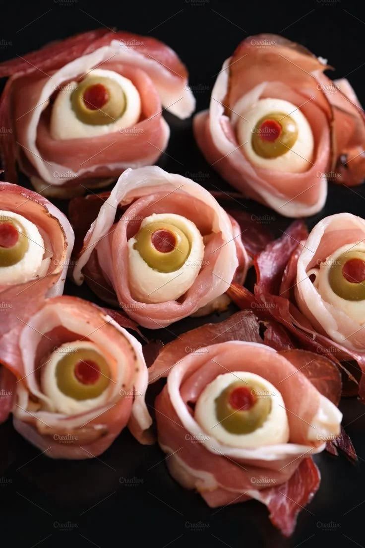 Halloween snack eyeballs made with jerked beef and cured meats.
