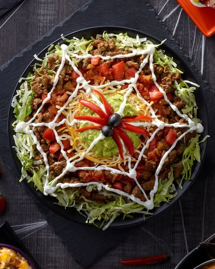 Delicious spooky spread for Halloween party with eerie treats and decorations