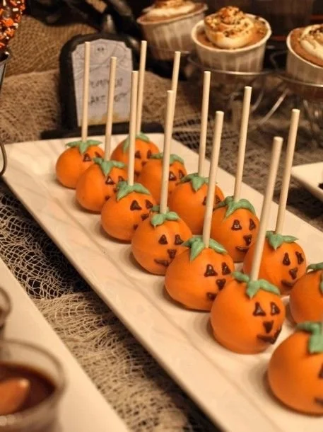 Spooktacular Halloween dessert table featuring themed treats and decorations.
