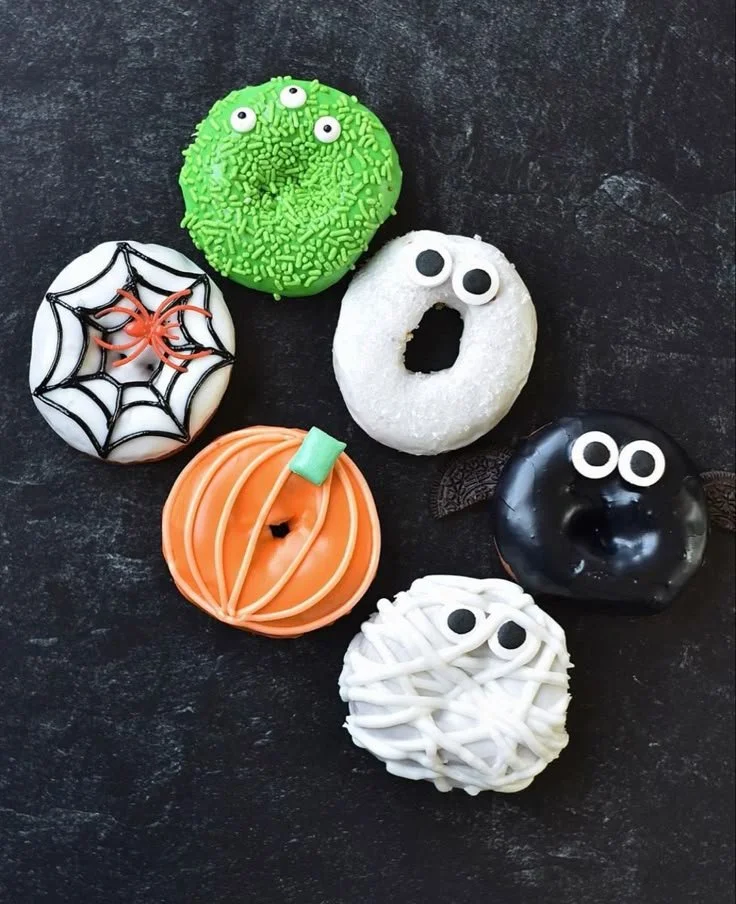 Spooky Halloween mini donuts decorated with festive designs for Halloween