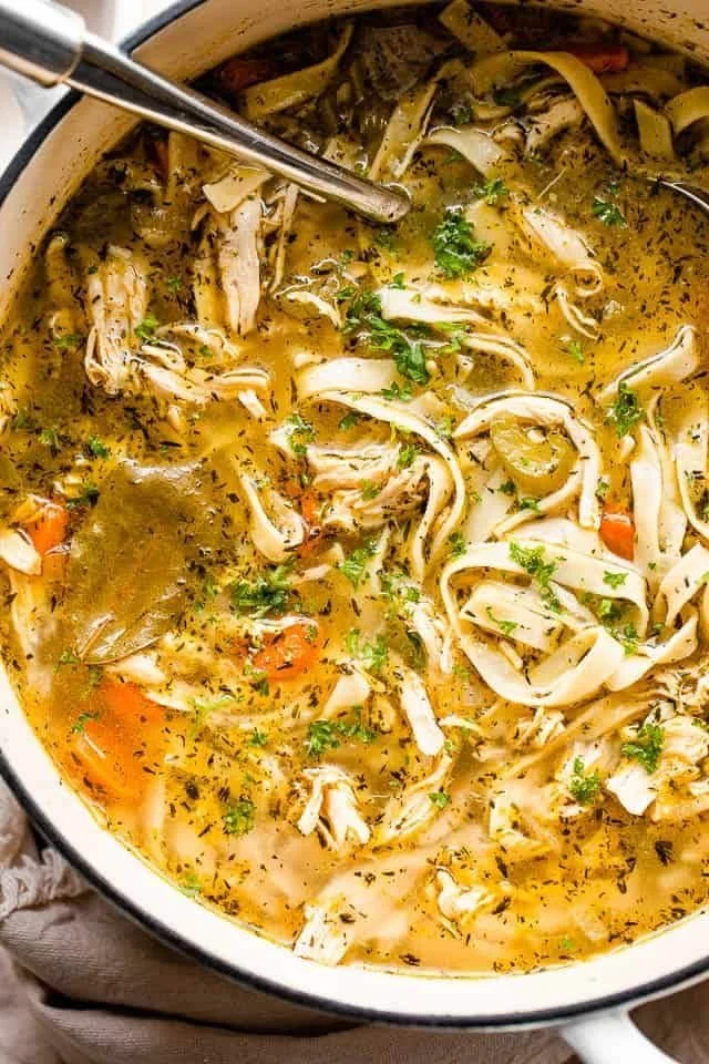 A bowl of homemade chicken noodle soup, perfect for winter comfort.